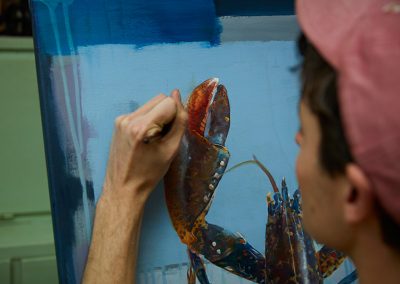 Dan Quirke painting the lobster